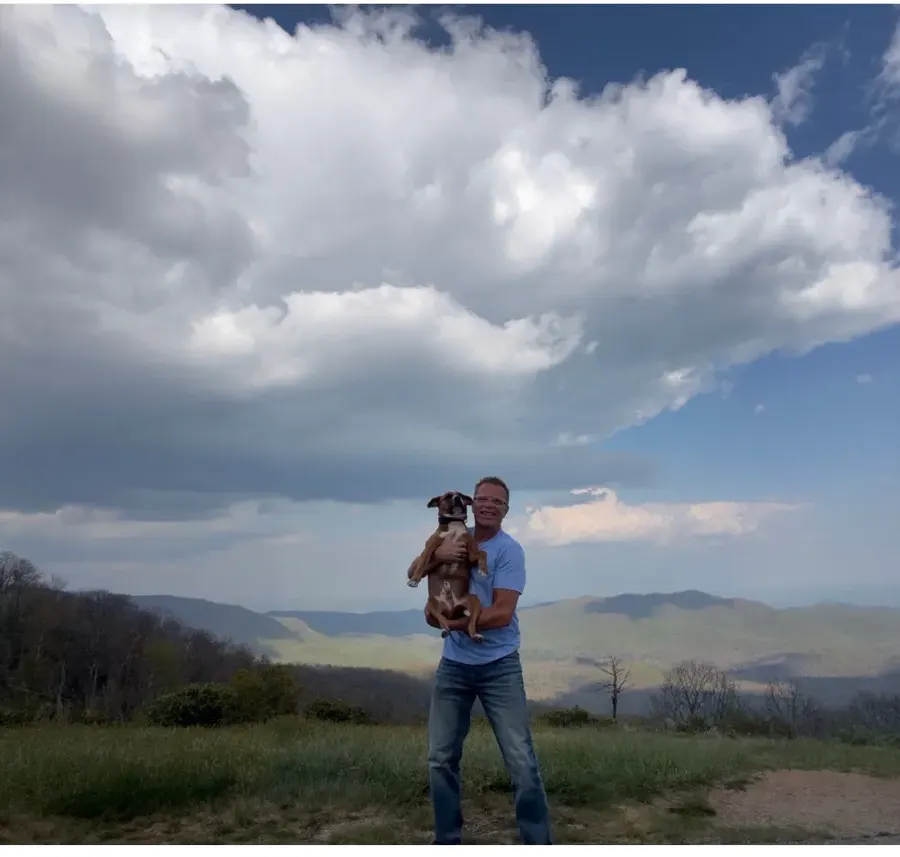 Todd and his dog at an overlook