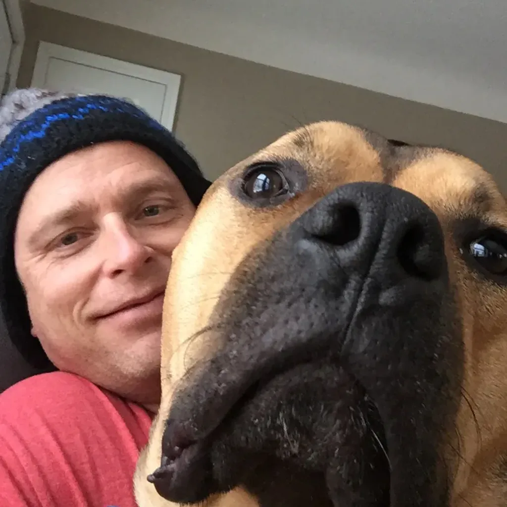 Todd with his dog close to the camera